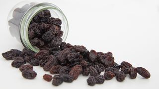 Raisins spilling out of jar